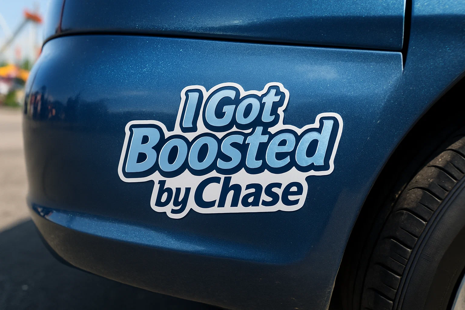 Metallic blue car fender with a bumper sticker reading “I Got Boosted by Chase”—close-up, high gloss.
