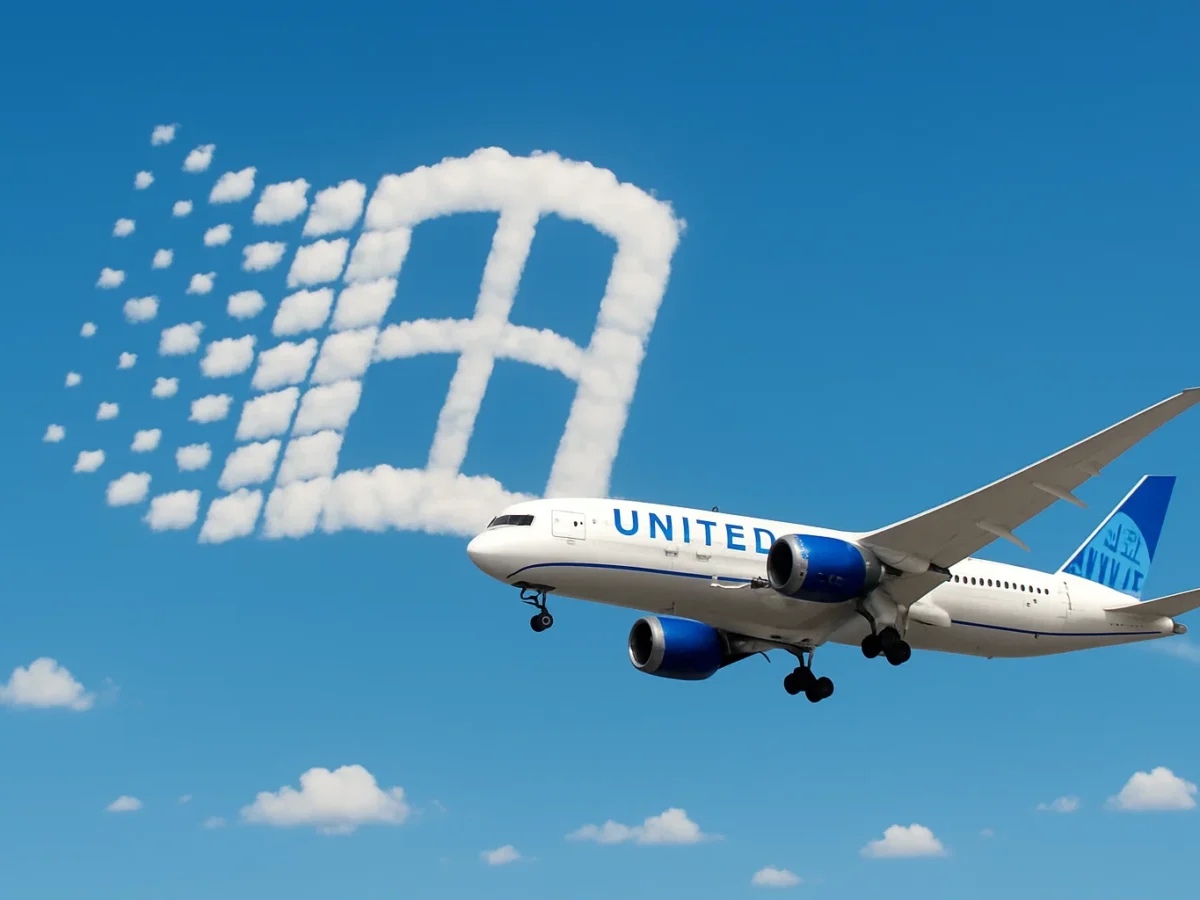 a plane flying in the sky with clouds in the sky